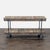 Industrial style reclaimed wood console with iron fittings. Brand: Pottery Barn. Original Price: $1609. Dimensions (in):...