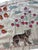 Hand-embroidered Suzani panel from Uzbekistan, worked in fine floss on a cream cotton ground. Three tigers move across the...