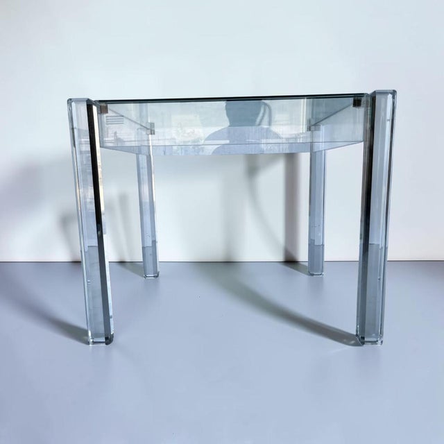 Vintage mid-century modern lucite and glass side table. Unique minimalist piece, made up of glass top, lucite frame and...