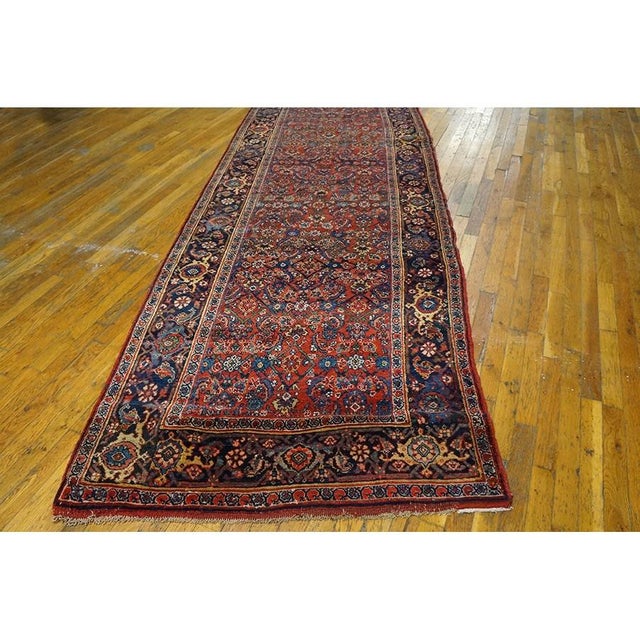 Antique Bijar Hallway Runner Wool Red Rug, Circa Date: 1890s. This exceptional late 19th-century piece exemplifies the...