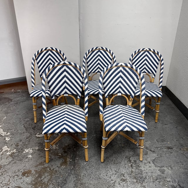 Design Plus Gallery presents a Set of Five Riviera Rattan Dining Chairs from Serena & Lily. Inspired by classic Parisian...