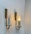 A pair of sleekly designed danish modern wall sconces fashioned out of brass. Manufactured and designed by Lyskær...