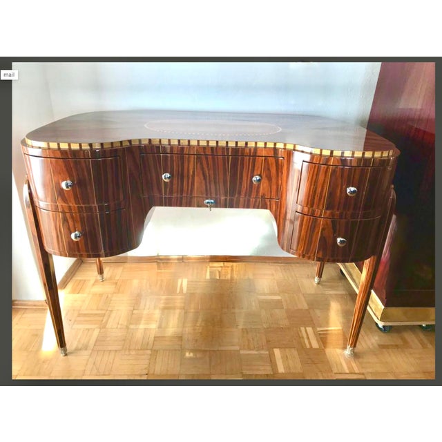 Art Deco Style Desk in Walnut, in Restored conditions. Designed 1990 to 1999 This piece is attributed to the mentioned...