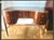 Art Deco Style Desk in Walnut, in Restored conditions. Designed 1990 to 1999 This piece is attributed to the mentioned...
