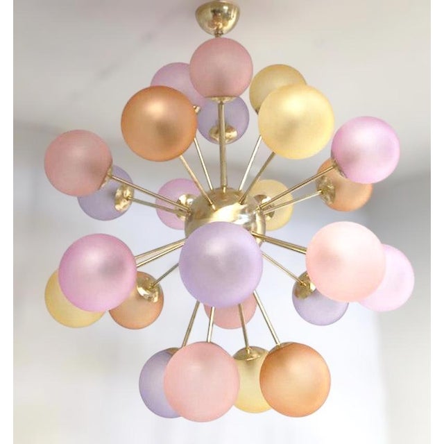 Italian sputnik chandelier with 24 multicolored Murano glass globes in satin matte finish, mounted on brass frame in...