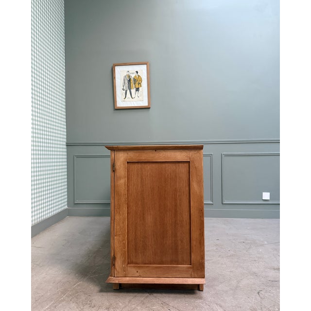 This large vintage sideboard, typical of the 1950s, is appealing thanks to its clean, balanced lines, emblematic of post-...