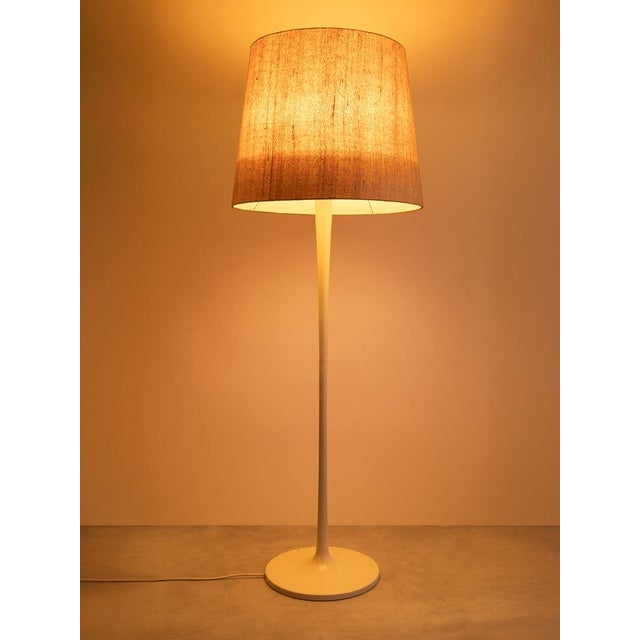 This elegant floor lamp from the 1970s was manufactured by the renowned company staff. Its sleek, conical tulip-shaped...