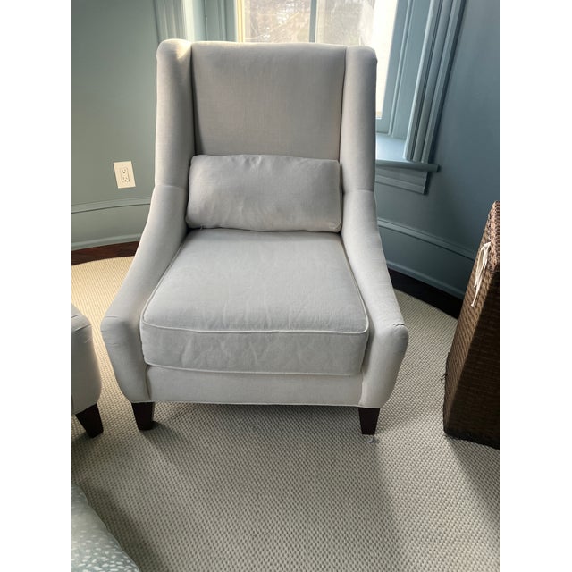 The Mitchell Gold + Bob Williams Marlena chair is a low-slung, modern chair featuring English arms, a high back, and a...