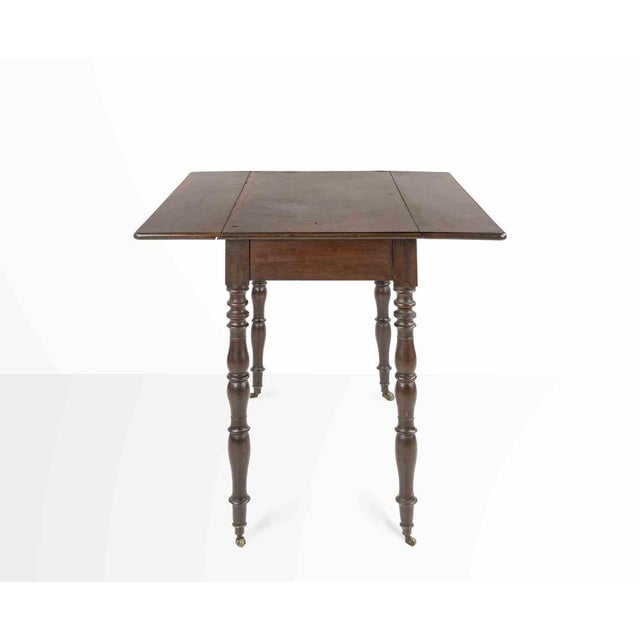 Small vintage table is a modern design item realized in the mid-20th Century Small mahogany side table in style. Openable...