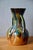This captivating amphora-shaped vase in glazed ceramic perfectly captures the warm, creative spirit of the 1970s. Its...