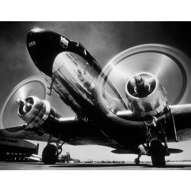City of Portland Low-angle view of a Douglas DC 3 airliner 'City of Portland,' with its propellers spinning in preparation...