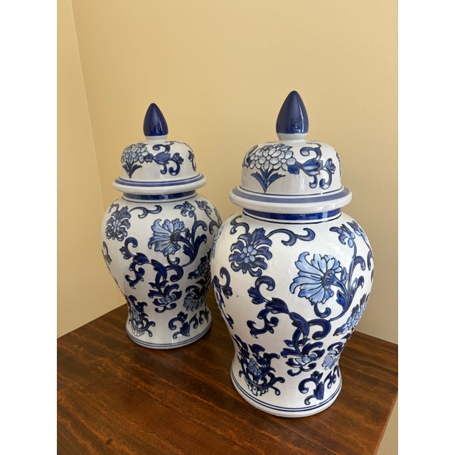 A beautiful pair of large Chinoiserie blue and white porcelain covered ginger jars or temple jars China, Late 20th Century...