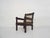 Beautifuly carved wooden lounge chair with rope seating and back.