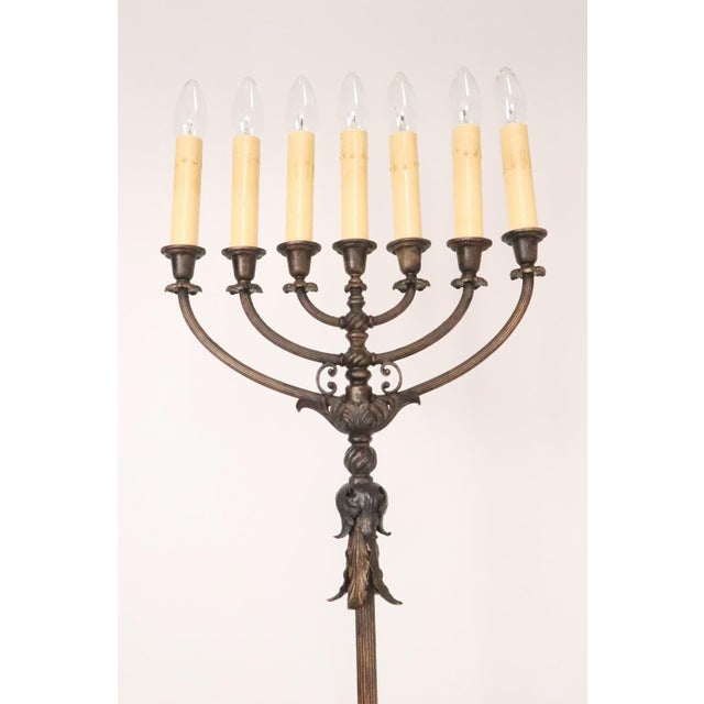 Late 19th century Menorah candelabras that have been electrified. The bases are marble and iron with detailed...