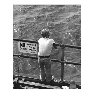 1975 Santa Monica Pier Fisherman Photograph by Don Ware