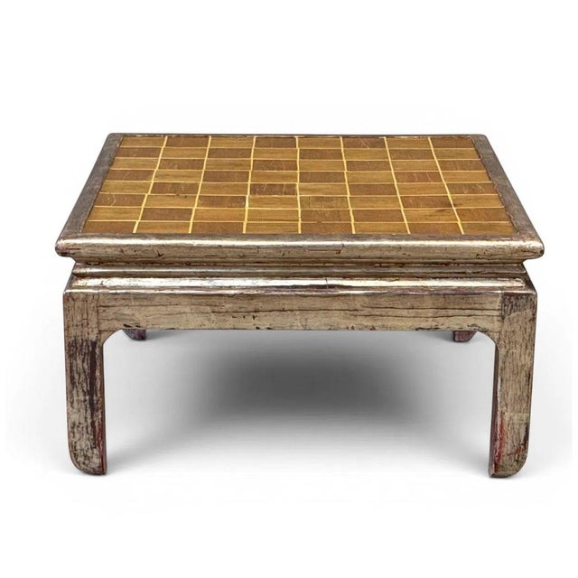 A vintage coffee table by Hal Kuehne, featuring a richly aged silvered frame and a graphic grid patterned inset top in...