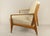Mid-Century lounge chair made of solid oakwood, attributed to Eugen Schmidt. Features a dynamic design with integrated...