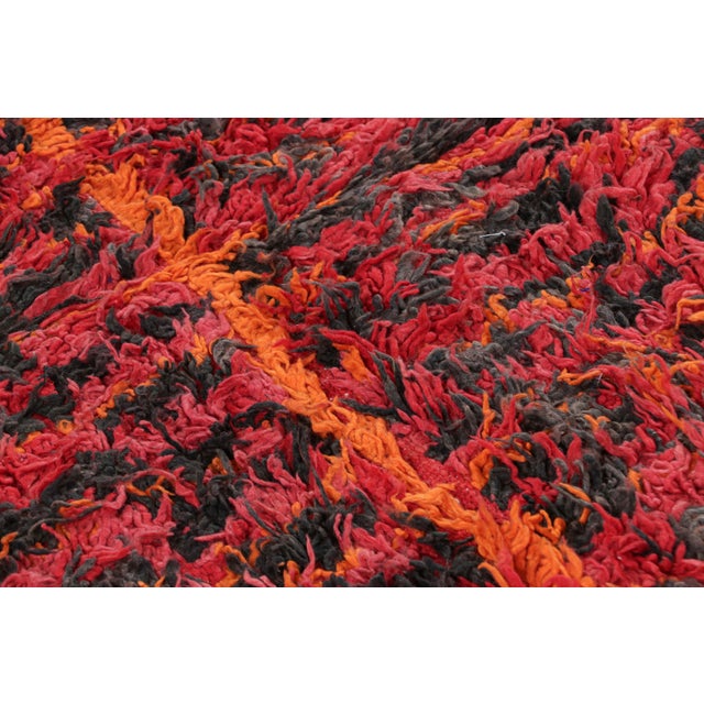 Hand-knotted in wool and originating from Morocco circa 1950-1960, this 6x7 vintage rug is a rare and among the most...