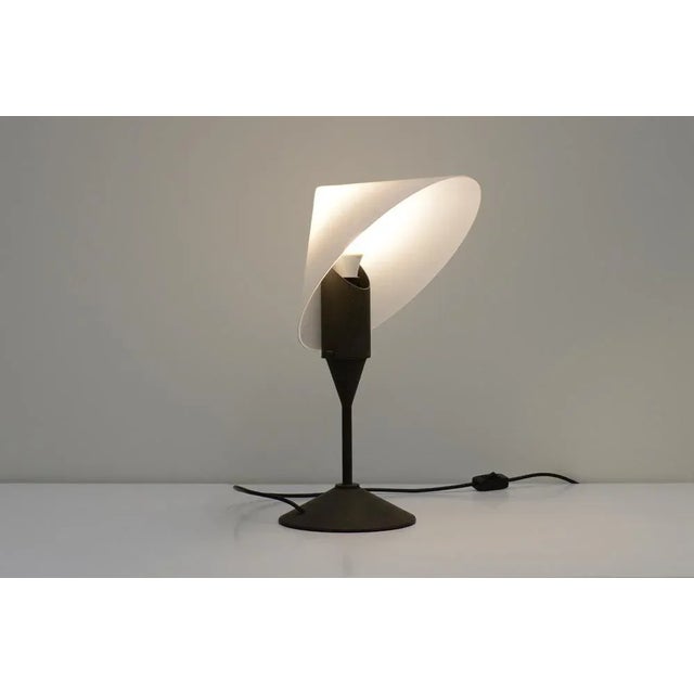 Table lamp by VeArt, Italy 1980s. White glass cone shaped shade and metal patinated base. This is a rare lamp as we can...