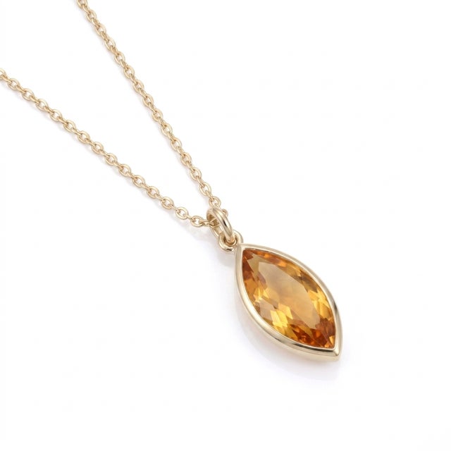 Radiate warmth, energy, and elegance with this striking marquise gemstone pendant necklace. Featuring a hand-selected,...