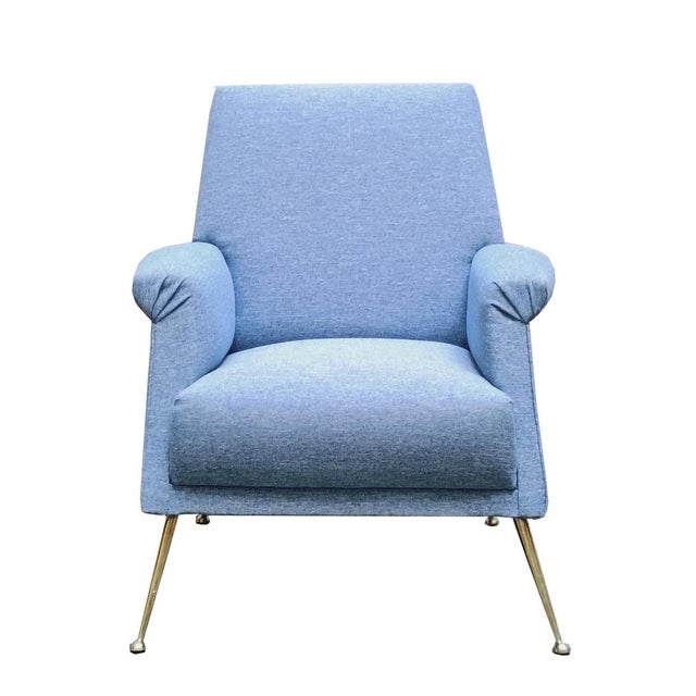A beautiful Italian armchair from the 1960s with a wide backrest and upholstered armrests offering great comfort and...