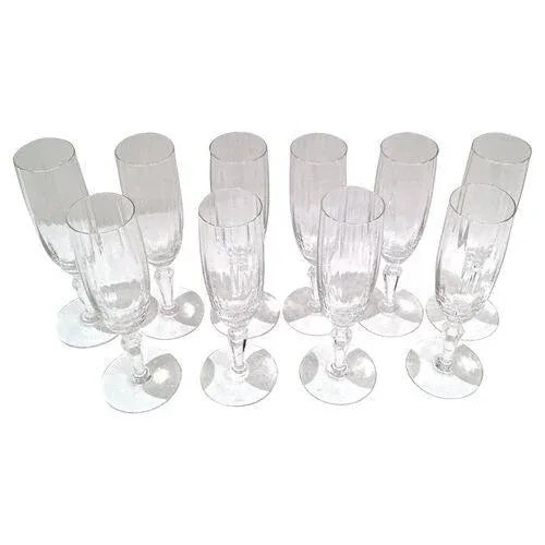 Set of 10 vintage Baccarat crystal champagne flutes. Marked "Baccarat" on the underside.