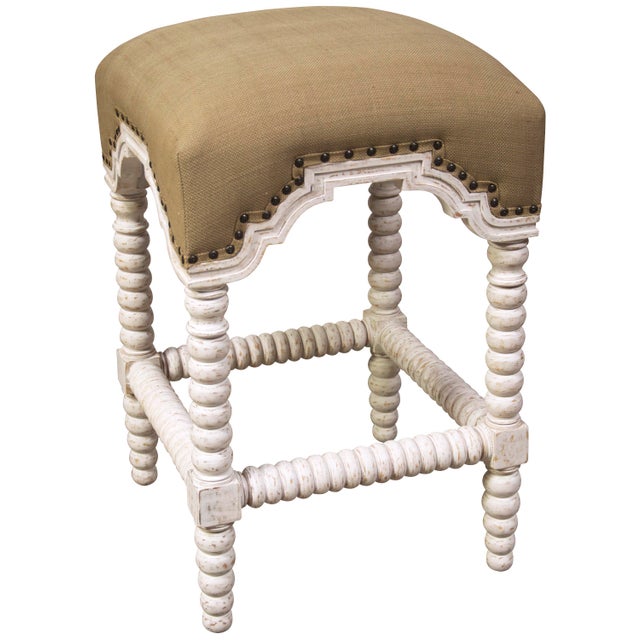 This opulent stool features a plethora of luxe details including ornate bobbin-turned legs and stretchers, and a soft...