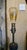 A distinctive antique industrial table lamp fashioned around a traditional candy roller mechanism, combining the character...