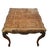 French provincial/Louis XV style table with parquetry top, floral carved apron and legs. Wood appears to be either beech...