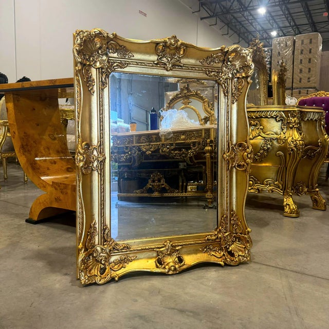 Transform any room with depth, dimension, and elegance with this exquisite French Baroque wall mirror. This beautifully...