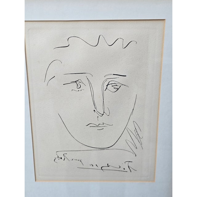 This is an authorized etching entitled "Poor Robie" by Pablo Picasso with an authentication stamp on the back. This is...
