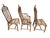 Wonderful set of vintage rattan chairs. We may have cushions, but they would be third party and not the originals. One...