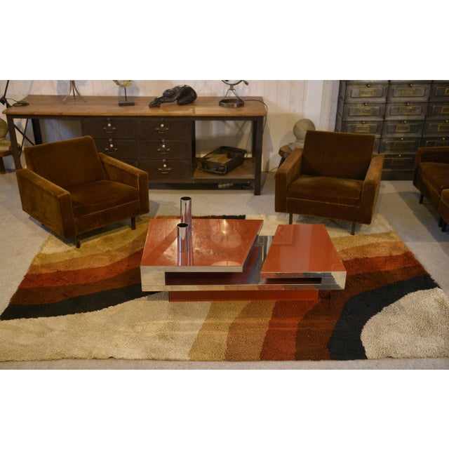 A 1970s designer coffee table by Philippe Jean, with a distinctly "space age" aesthetic. It is distinguished by its...