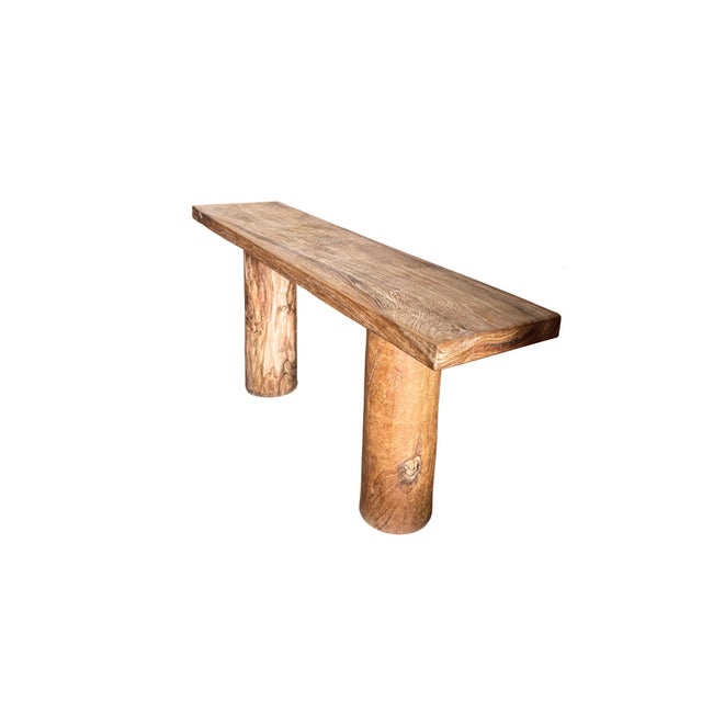 This solid teak console table is defined by its bold simplicity and timeless materiality. Crafted entirely from teak wood,...