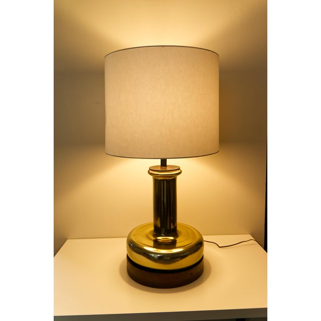 Late 20th-century mercury glass table lamp featuring a reflective gold-tone finish and a sculptural silhouette, all set on...