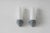 A pair of minimalist wall lamps, designed by Stig Carlsson for the Swedish manufacturer Ifö—a brand known for its top-...