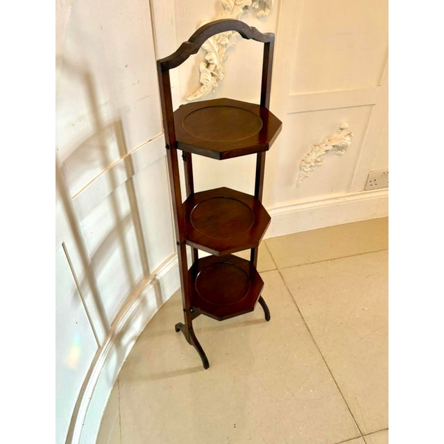 A charming mahogany three-tier folding cake stand elegant in form and beautifully made. The stand features three octagonal...