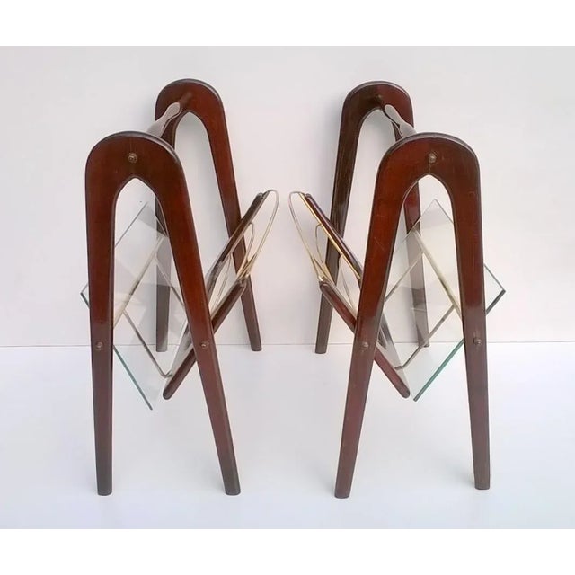 Set of two magazine racks designed by Cesare Lacca in the 1950s. Beech wood stained mahogany. Very good condition....