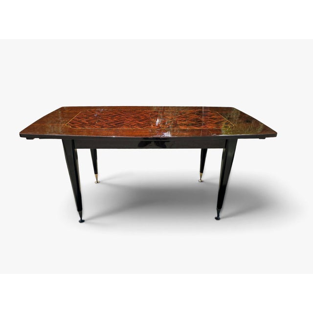 Elegant and luxurious French dining table from the 1970s, designed in the refined Art Deco style. Crafted from richly...
