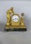 Empire or Directoire period clock depicting a woman reading, 19th century For Sale