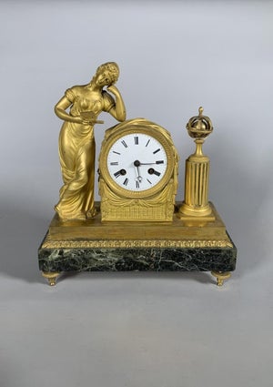 Empire or Directoire period clock depicting a woman reading, 19th century