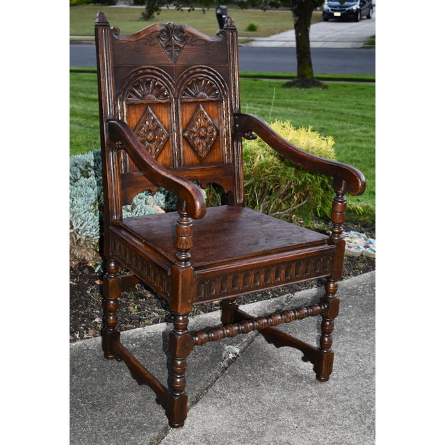 Antique (1920's) Arm Chair has a Tudor Style. Made by Kittinger Furniture. The Wood is Oak. Carved Oak. Newer Pillow. The...