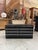 Low black cabinet with 8 functional drawers, enhanced with stainless steel finishes and handles. Ample storage capacity,...