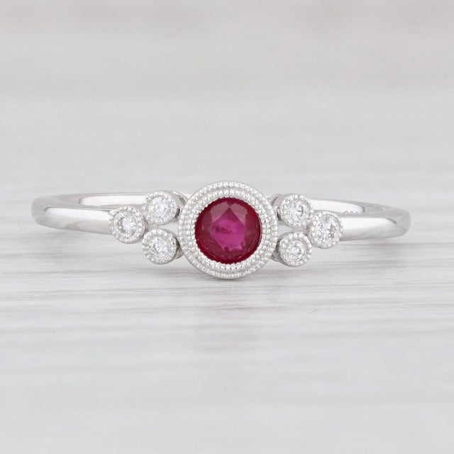 Gemstone Information: - Natural Ruby - Carats - 0.25ct Cut - Round Brilliant Color - Red Treatment - Routinely Enhanced -...