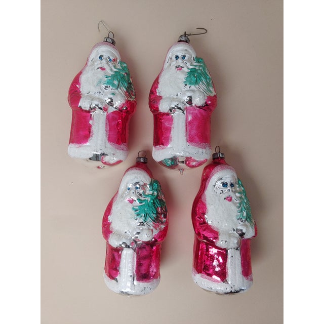 A wonderful Santa ornament from Germany for your vintage Christmas collection. This is a hand blown ornament. There are...