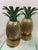 A great pair of solid brass pineapples book ends with attached leafy tops. The tops are attached by two screws at the top...