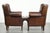 This lovely set of 2 subtle English-style sheepskin wingback armchairs features beautiful colors and is equipped with a...