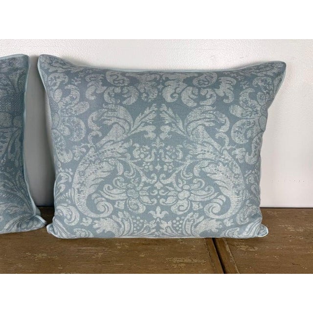A refined pair of designer decorative pillows featuring a classic European-inspired damask pattern woven in soft, tonal...