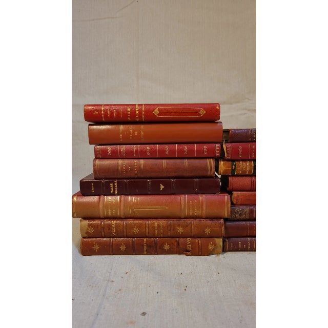 These are beautiful, vintage leather books in multiple languages and subjects. These red books come in various sizes.