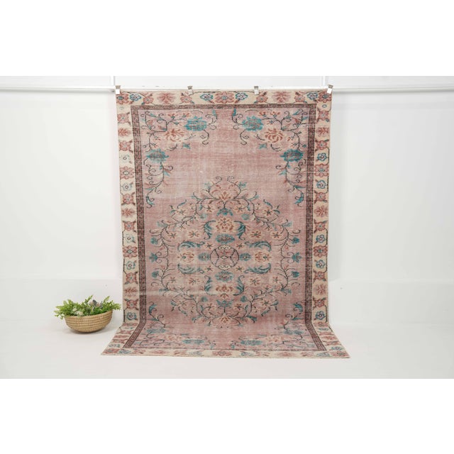 Vintage Hand-Knotted runner rug is a semi-antique vintage area rug. The '70s Eastern region of Anatolia's unique rug is...